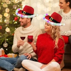 Julklapp för kvinnor och män - Ljusupplyst LED-blinkande julklapp med fjäderhatt Cowboy Röd Jultomte Western Semesterhatt><noscript><img width=